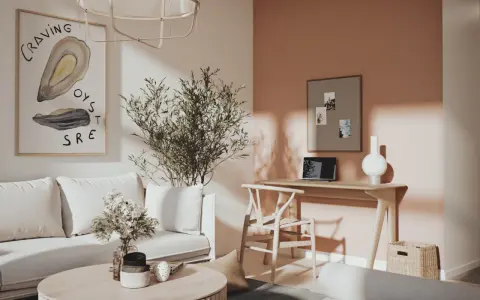 Ett inrett litet rum med en bekväm soffa, ett runt soffbord med blommor och en arbetsplats vid ett fönster.