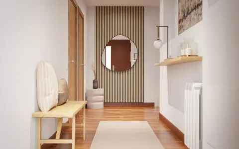Un pasillo oscuro con puertas de madera, un banco, un espejo redondo y una alfombra.