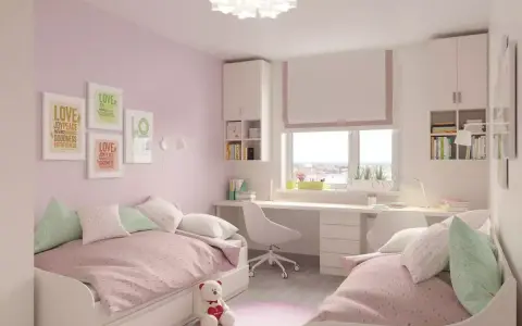 Pokój rodzeństwa z dwoma łóżkami i biurkiem. Inspiracja, jak podzielić pokój rodzeństwa, by każde miało swoją przestrzeń.