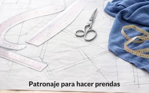 Herramientas de costura sobre un patrón de ropa. Tijeras, reglas y cinta métrica listos para crear un nuevo diseño.