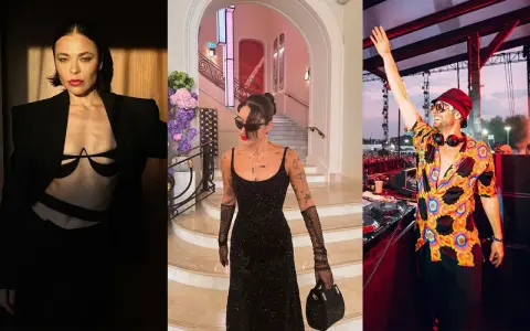 Un french dj con cappello e camicia colorata saluta il pubblico. A sinistra, due donne in abiti eleganti.