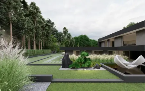 Nowoczesny ogród z trawami, kamieniami i rzeźbą w stawie. Dom o minimalistycznej architekturze otoczony zielenią.