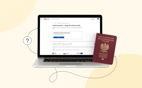 Laptop z otwartą stroną gov.pl o paszportach i polski paszport obok. Wniosek o paszport w Łodzi? Sprawdź, jak go uzyskać online.