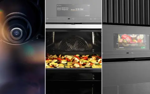 Nahaufnahme einer Miele Backofen Kamera, die durch das Glas auf mediterranes Ofengemüse blickt.