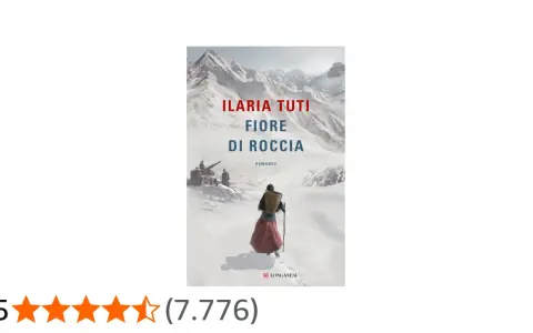 Copertina del romanzo "Fiore di roccia" di Ilaria Tuti. Una figura con un cesto in spalla cammina su un sentiero innevato, con montagne sullo sfondo.