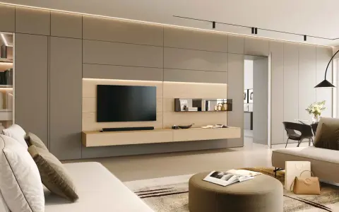 Ecco come arredare una parete attrezzata moderna: un mobile sospeso in legno chiaro con TV, mensole minimaliste e illuminazione integrata.