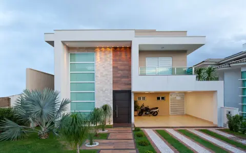 Una casa moderna con líneas limpias y materiales mixtos, que muestra la diversidad de los tipos de casas del mundo.