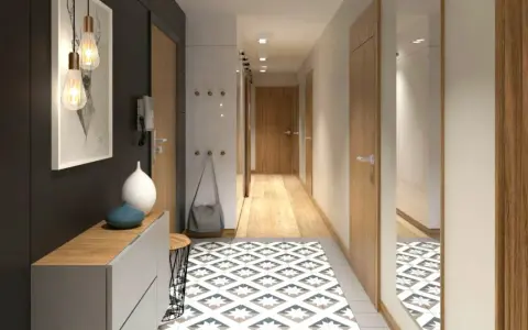 Un corridoio stretto con idee di design moderne: tappeto geometrico, mobili minimalisti, luci a sospensione e specchio a tutta altezza.