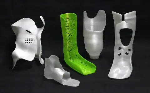 A collection of orthopedic devices, including braces and prosthetic components, showcase the versatility of polypropylene 3D printing.