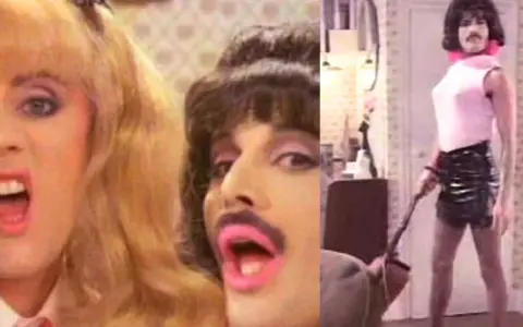 Freddie Mercury w klipie "I Want to Break Free" Queen, w różowej bluzce i skórzanej spódniczce, z warkoczem i szminką.