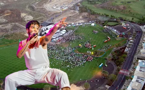 Camilo canta en un multitudinario concierto al aire libre. El artista, con su característico estilo, domina el escenario ante miles de fans.