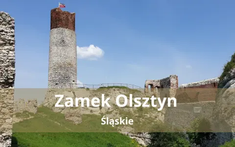 Zamek Olsztyn, ruiny średniowiecznej warowni na Jurze Krakowsko-Częstochowskiej, dumnie wznosi się na tle błękitnego nieba.