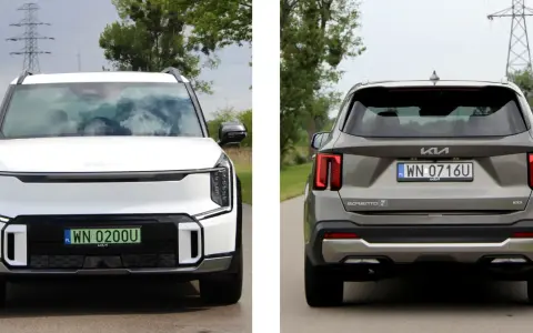 Biała Kia EV9 z przodu i szara Kia Sorento z tyłu, obie na drodze.