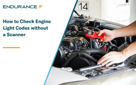 Learn how to read engine codes without a scanner. A person holds a red diagnostic tool near a car's engine.