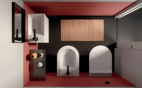 Bagno moderno con wc e bidet di fronte, tappeto in juta e lavabo squadrato.