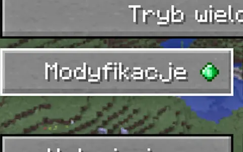 Ekran gry Minecraft z przyciskiem "Modyfikacje" i zielonym szmaragdem.