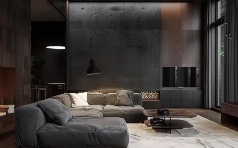 Nuancier : le gris foncé du canapé se marie aux tons chauds du bois et à la texture brute du mur.