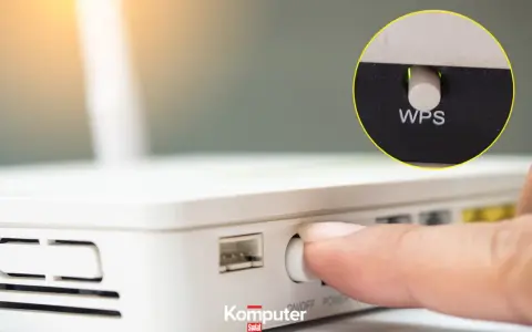Palec naciska przycisk WPS na routerze, ułatwiając połączenie z siecią Wi-Fi.