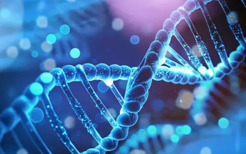 Niebieska podwójna helisa DNA, symbolizująca genetyczne podstawy, rodzi pytanie: czy autyzm jest dziedziczny?