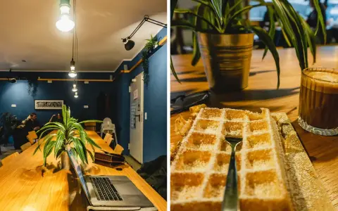 Gemütliches Cafe mit langen Holztisch, Laptop und Waffel mit Kaffee. Perfekt zum cafe lernen und entspannen.