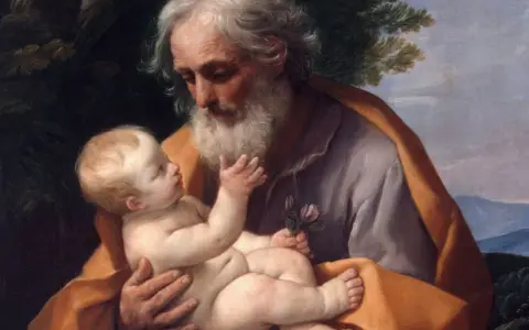 Święty Józef czule trzyma Dzieciątko Jezus, symbolizując opiekę i miłość. Obraz ten może inspirować do modlitwy do św. Józefa.