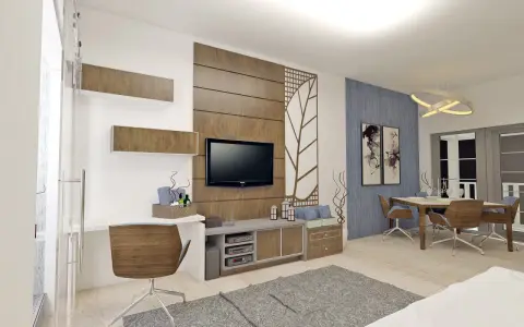 Un soggiorno moderno con scrivania, TV e zona pranzo. Il marrone e il grigio stanno bene insieme, creando un'atmosfera accogliente.