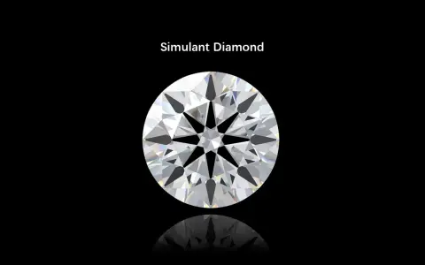 A brilliant round cut simulant diamond sparkles against a black background, showcasing its facets and fire.