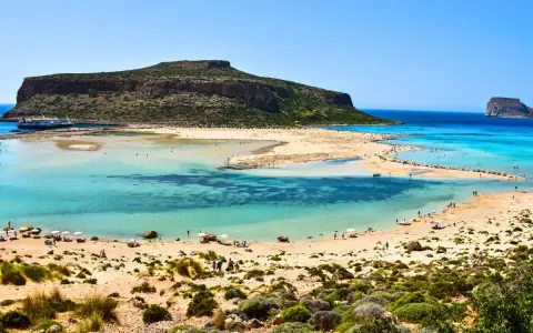 Balos Lagoon, Crete, Greece: turquoise waters, sandy beaches, and a dramatic island backdrop make this the best island in Greece for a perfect beach day.
