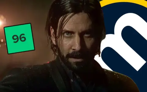 Alan Wake 2 análisis: el personaje principal con una puntuación de 96 en un recuadro verde y un logo de "m" al lado.