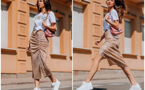 Kobieta w błyszczącej spódnicy i białej koszulce prezentuje miejski styl. Jej stylizacja to kwintesencja street fashion.