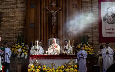 Clergy at an altar during a religious service. The length of vigils can vary, but this scene captures a moment of solemnity.