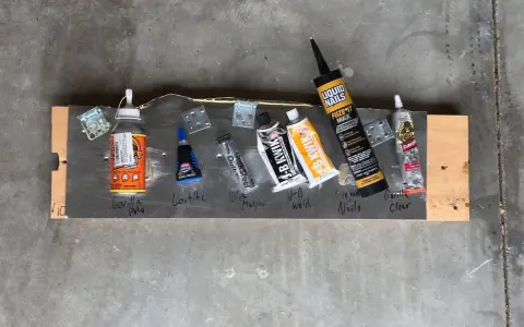 Adhesives are laid out on a board, including Gorilla Poly, Loctite, and Gorilla Clear, to test if Gorilla Glue works on resin.