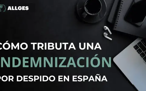 Cómo tributa una indemnización por despido improcedente en España. Imagen de escritorio con portátil, móvil y café.