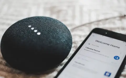 A smart speaker and phone display "Welcome Home" and "1 device found," showcasing modern iot design for a connected home.