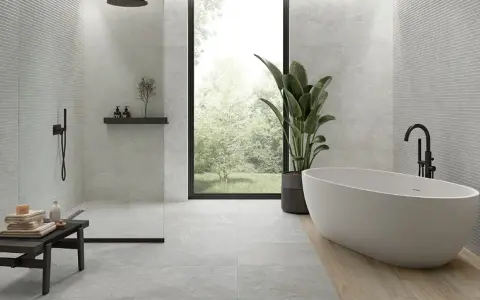 Baño moderno con ducha y bañera. Ideas para como combinar azulejos en duchas con texturas y acabados variados.