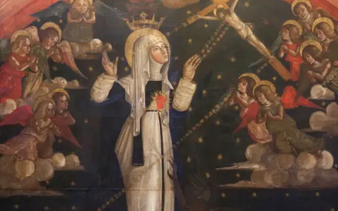 Saint Catherine of Siena, crowned and with a flaming heart, receives stigmata from Christ on the cross, surrounded by angels.