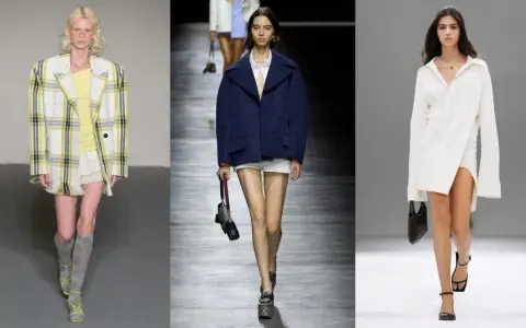 Modelli sfilano con look audaci: pelle strappata, blazer a quadri, abiti oversize e gonne scintillanti. Un'interpretazione moderna del preppy significato.