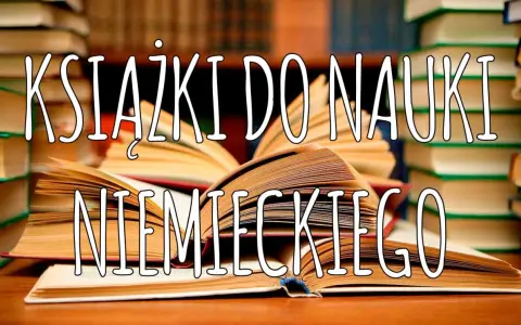 Otwarta niemiecka książka do nauki leży na stosie innych książek.