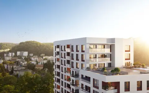Nowe inwestycje Gdynia: nowoczesny apartamentowiec z tarasami i widokiem na zieleń.