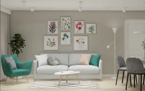 Miętowy fotel i poduszki z różem na jasnej kanapie. W tle galeria obrazów z kwiatami.