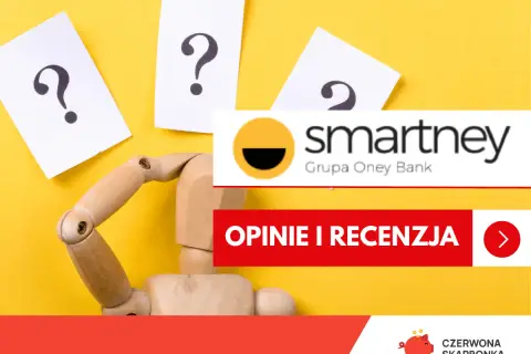 Drewniany manekin z pytajnikami zastanawia się nad przyznawalnością Smartney. Opinie i recenzja.