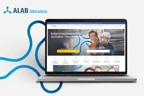 Laptop z otwartą stroną internetową ALAB Laboratoria, prezentującą ofertę badań i wyszukiwarkę pakietów.