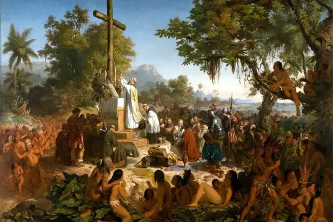 A priest leads a mass before a cross, surrounded by indigenous people and European explorers. This historical art in Brazil depicts a pivotal moment.