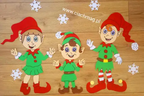 Trzy uśmiechnięte elfy w zielonych strojach i czerwonych czapkach, gotowe do świątecznych przygotowań. Jak zrobić elfa?