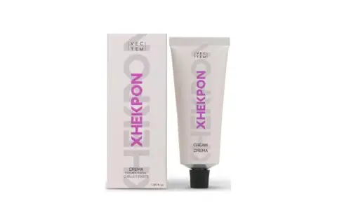 Crema Xhekpon, recomendada por dermatólogos. Caja y tubo de cuidado facial para cuello y escote.