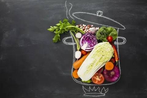 Świeże warzywa i fasola w narysowanym garnku. Inspiracja dla weganizmu a wegetarianizmu.