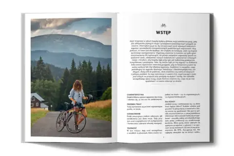 Kobieta z rowerem na tle gór i lasów. Idealna trasa rowerowa Hel czeka na odkrycie.