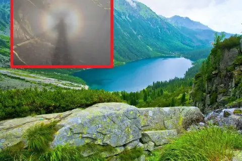 Widok na jezioro w górach, a w powiększeniu tajemnicza sylwetka otoczona tęczową aureolą – to efekt brockenu.