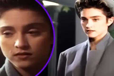 Młoda kobieta w szarym płaszczu i kapeluszu, jak z filmu "La Isla Bonita", zamyślona.