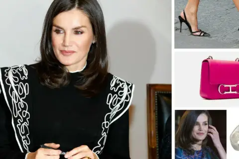 Letizia Ortiz, elegante en negro con detalles blancos, junto a un bolso fucsia y zapatos de tacón.
